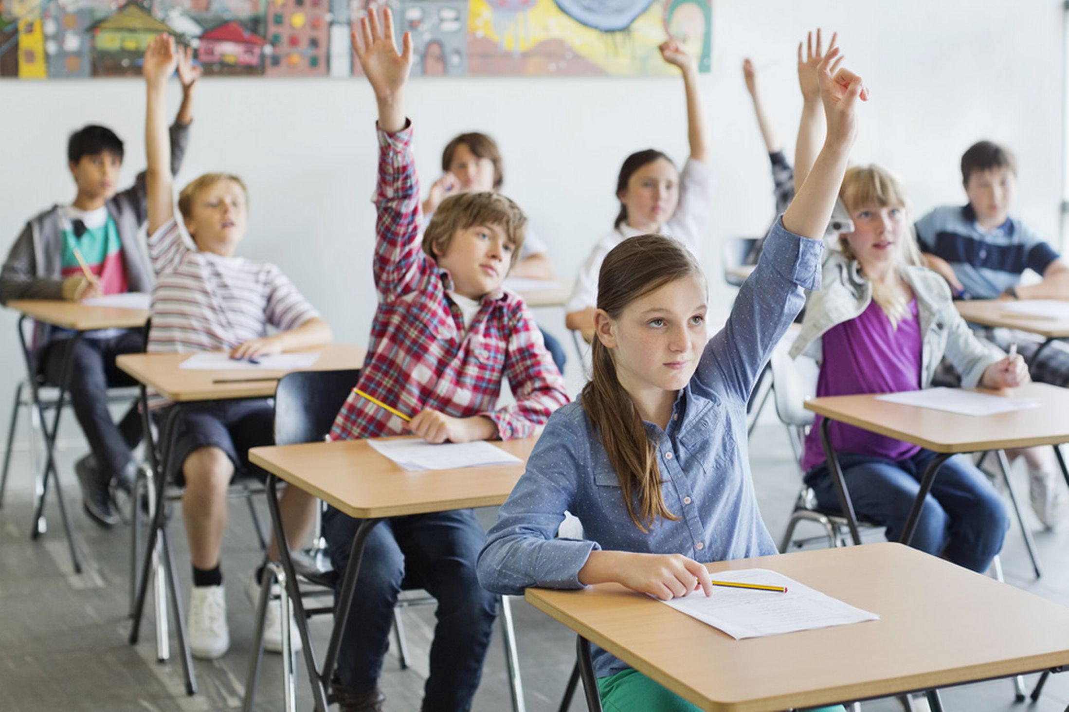 students raising hands